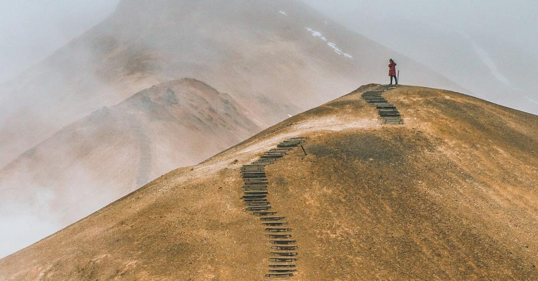 photo of person on mountains