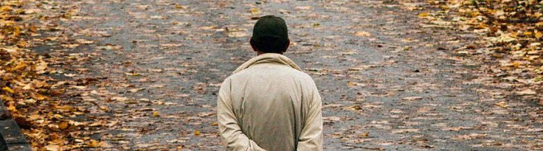 Man walking in leaves stretched 